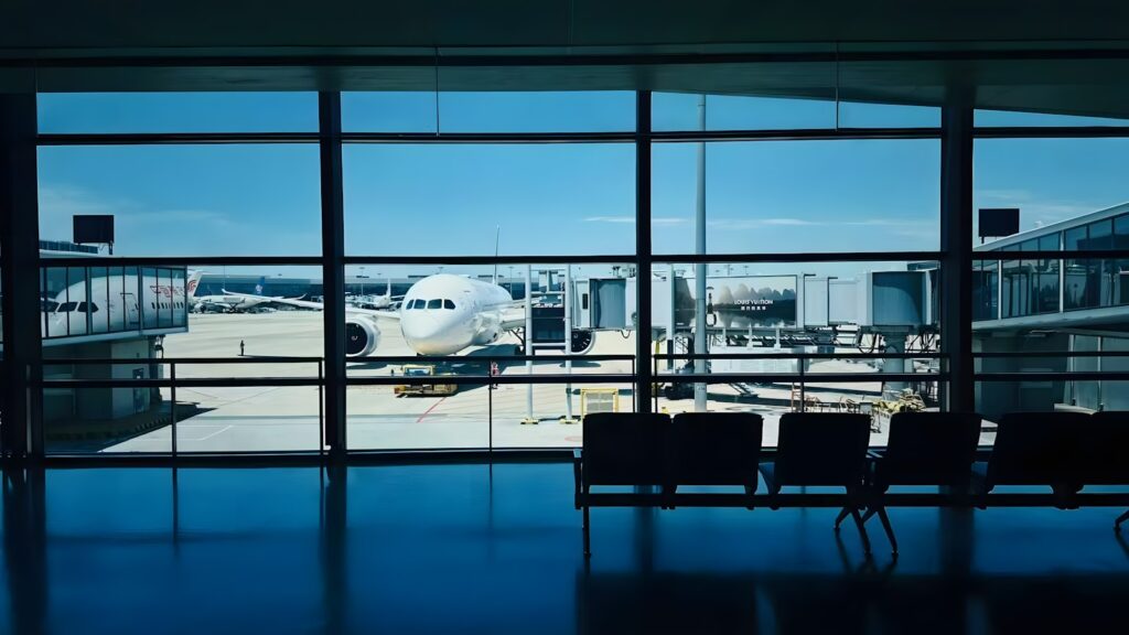Airplane preparing to land at Colombo Bandaranaike International Airport under a clear sky — supporting travel image 2