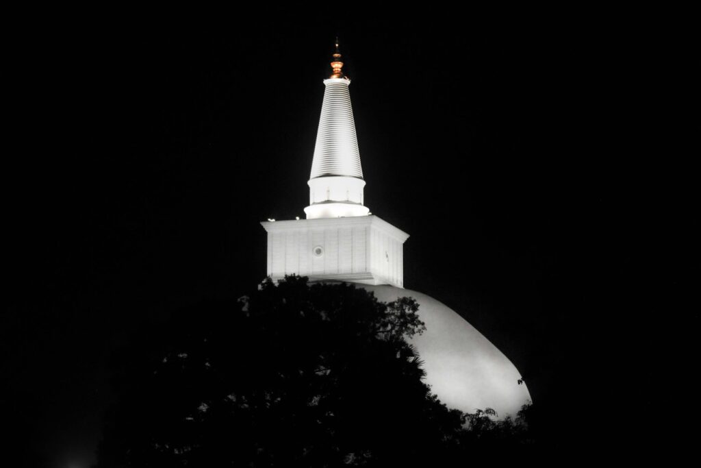 Alter Stupa in Anuradhapura with oil lamps
