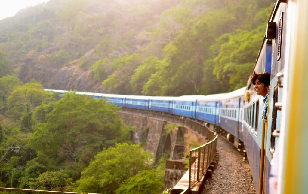 Scenic train passing through lush tea plantations in Sri Lanka's hill country near Ella — supporting travel image 3
