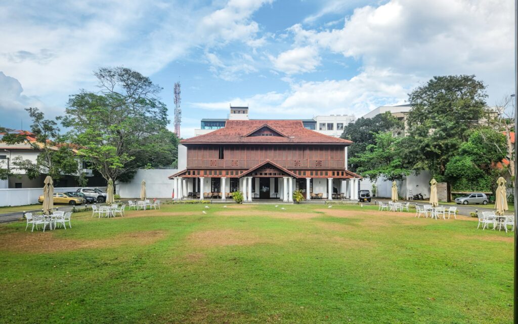 View of a restored historic villa with colonial architecture inside Galle Fort, Sri Lanka, showing weathered walls and modern design elements — supporting travel image 2