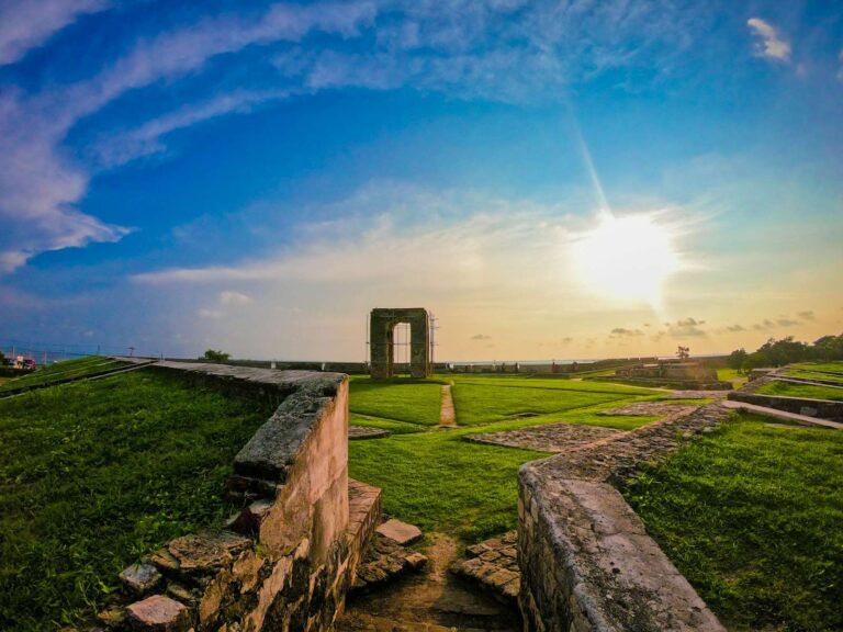 Sunset view from the ramparts of Jaffna Fort overlooking the lagoon and palm trees